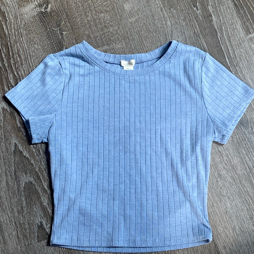 I’m selling a blue U cut croped T- shirt from Bozzolo size small.